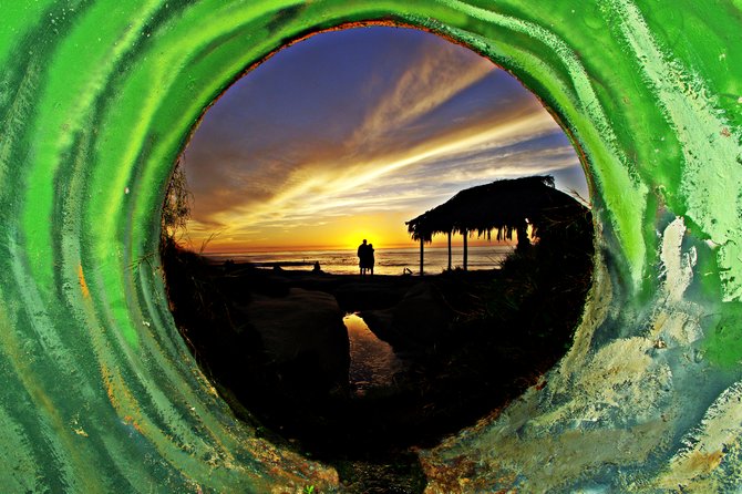 photo taken in the sewer pipe at windandsea beach in la jolla
This is certainly reflective of life, sometimes we have to go through our storms and ride out the hard times. When those times seem harder, life makes you go through the sewer with the water that life's storms bring. So many times we get stuck going through a dark sewer that we never get to see the beauty at the end of it.

