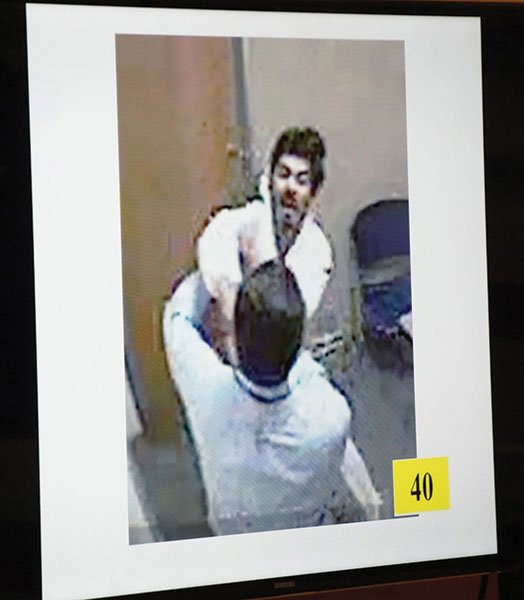 A surveillance camera caught suspect David Diaz trying to punch Carlsbad detective Scott Stallman.