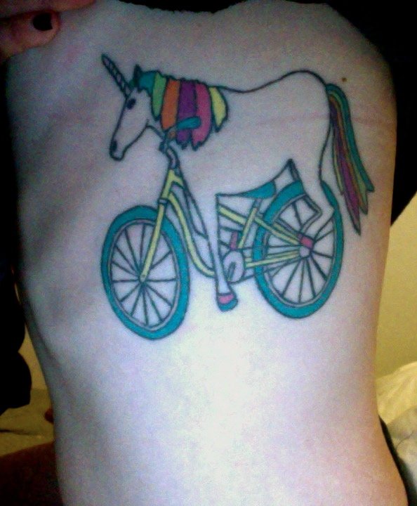 This is my unicorn Warren.  He is my favorite tattoo that I have.  I got him because he makes me smile!  I also love Warren because he has the ability to make others smile as well. Warren is a best friend tattoo.  My very dear friend Kyle got the same tattoo at the same time in a shop called No Ka Oi in Philadelphia where I used to live.  We both are very passionate about our love for unicorns as well as bicycles so it only seemed natural to have them together.  I am 28 and currently reside in Encinitas.  I live by the beach and work at a yoga studio.  Warren and I couldn't be happier. xxox