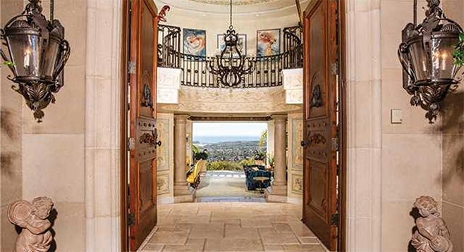 Pecan wood front doors, a grand rotunda foyer, and view over Batiquitos Lagoon and the Pacific to San Clemente Island are among the features of this Carlsbad estate.