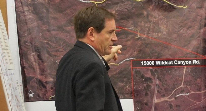 Prosecutor Paul Greenwood w a map of the remote location of "body dump." Photo by Eva