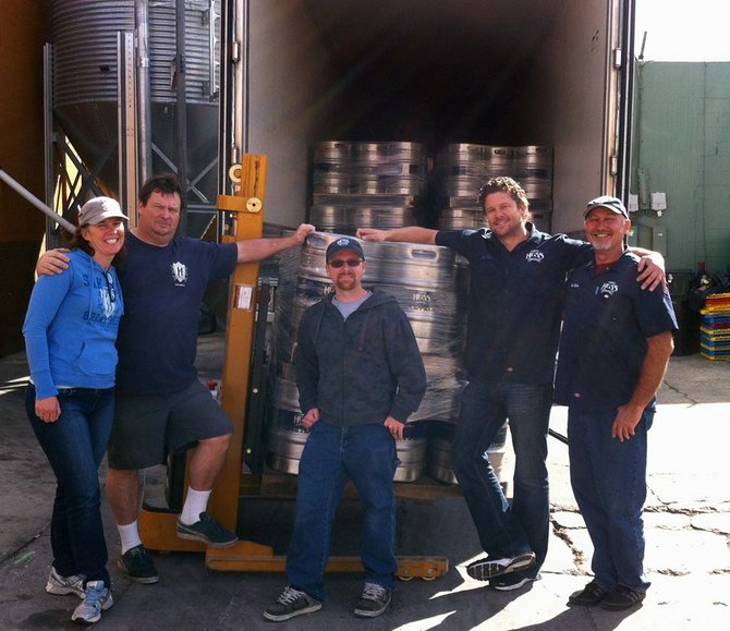 Jason Stockberger (center) in his new found Mike Hess Brewing Company glory.
