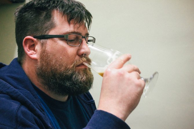 URBN St. Brewery brewmaster Callaway Ryan samples one of his early creations.