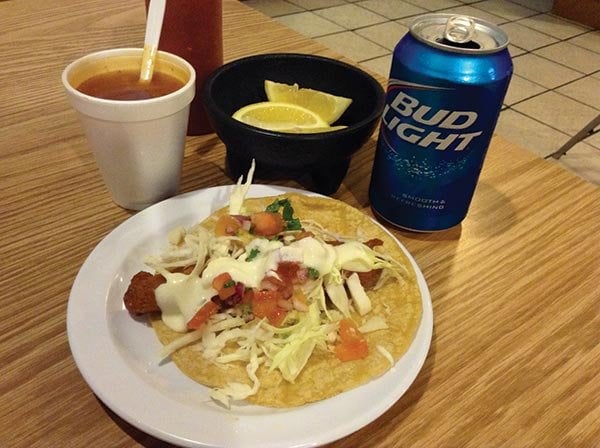 What $2.69 buys: a Bud Light, fish taco, and free fish soup
