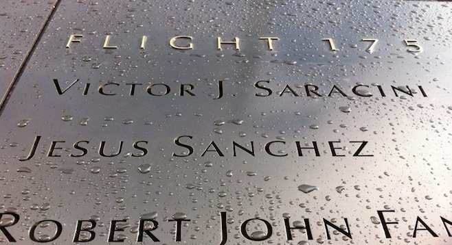 9/11 victims' names are engraved next to the memorial's twin reflecting pools.