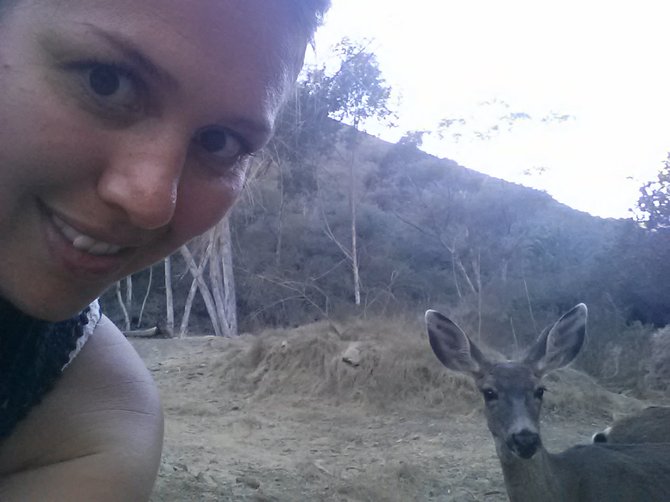 My sister with a friendly deer on Catalina Island near the Descanso Beach Club.