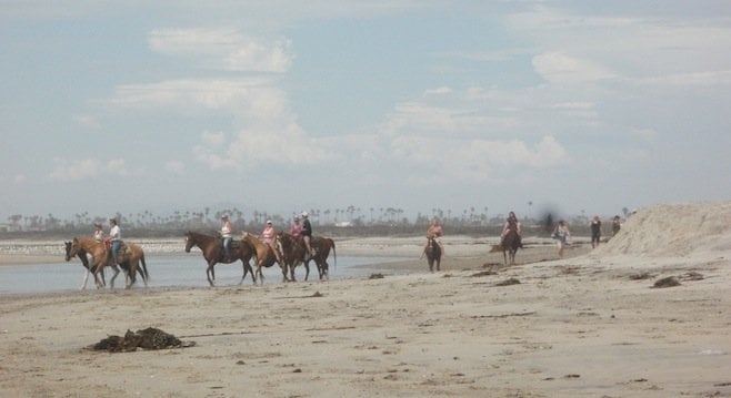 Equestrians on the beach at Border Field State Park, 1.5 miles north of the border by the Tijuana River mouth.