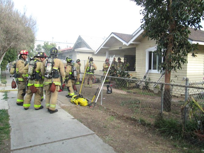 Firefighters responding to the house fire.