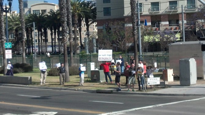 Drive for Universal Healthcare activists were briefly joined by a few Benghazi picketers across Harbor Drive