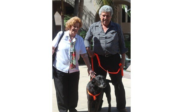 Cathy & John Hartman with Buddy, the lost Lab. 