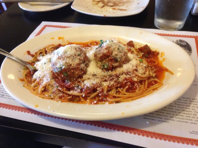 If you don't say stop, the Parmesan piles up. Spaghetti and meatballs. Mamma Teresa.