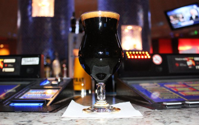 Iron Fist Velvet Glove imperial stout served among computer poker consoles at Corked in Harrah's Resort Southern California.