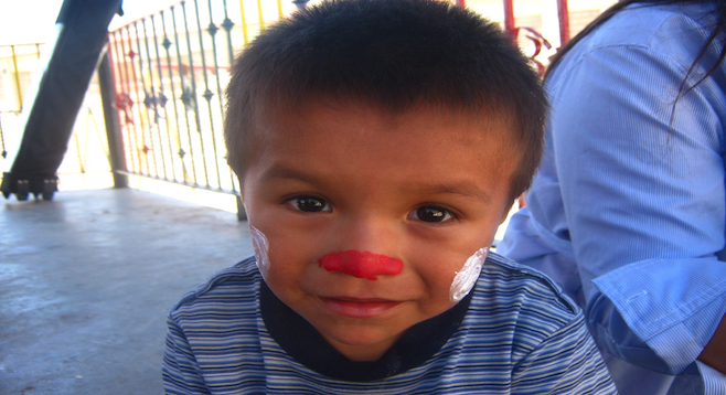 Face painting time at Tijuana's Casa Hogar El Faro orphanage. 