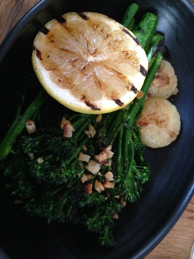 Grilled broccoli with peppers, onions, breadcrumbs and grilled citrus