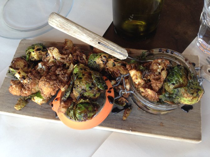 Crispy cauliflower and Bo-beau Brussels Sprouts at 100 Wines. 