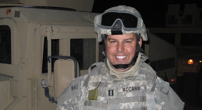 John McCann served a year in Afghanistan as a naval reservist.
