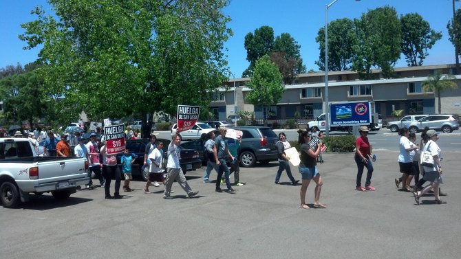 "Fight for 15" activists march on Balboa Avenue Burger King