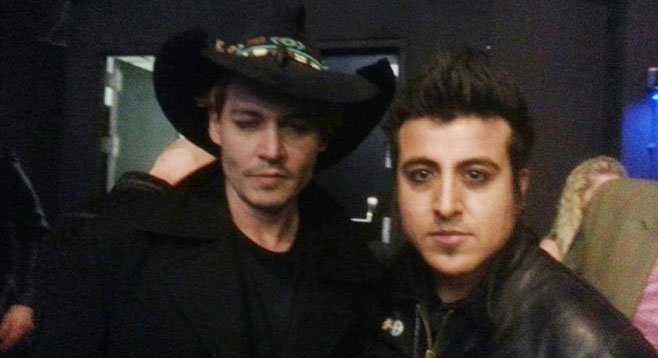 Photo op! Johnny Depp, Johnny Depp’s large hat, and Chris Leyva.