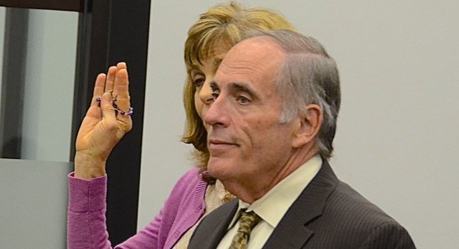 Donna Lee Darling hid behind her attorney in court today. Photo by Weatherston