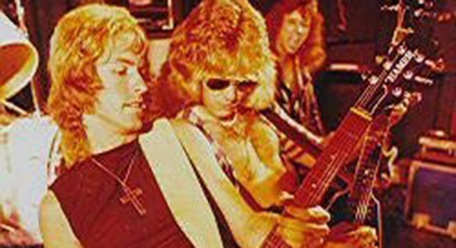 Ronny Jones (front) rocking out back in the day with Ratt’s Robbin Crosby.