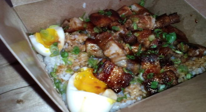 Pork belly adobo with fried rice and soft-boiled eggs at L.A.'s Oi Asian Fusion.
