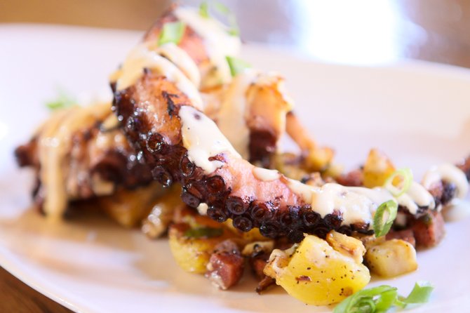 Davanti Enoteca in the Del Mar Highland Town Center braises octopus in red wine and wine corks. Then it's seared and serve it over a warm potato salad with celery root, finocchiona, and horseradish aioli. 
