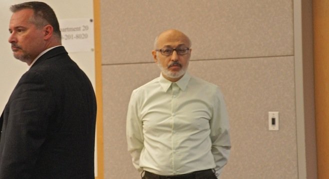 Attorney Richard Berkon w defendant Michael Vilkin. Photo by Eva