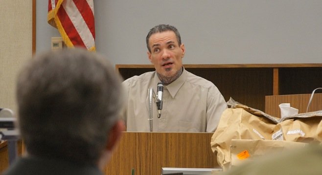 McCreary's head is in the foreground, he hears Withers in the witness box. Photo by Eva