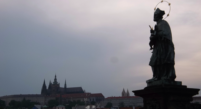 Looking out at the hilltop Prague Castle from the Charles Bridge. 