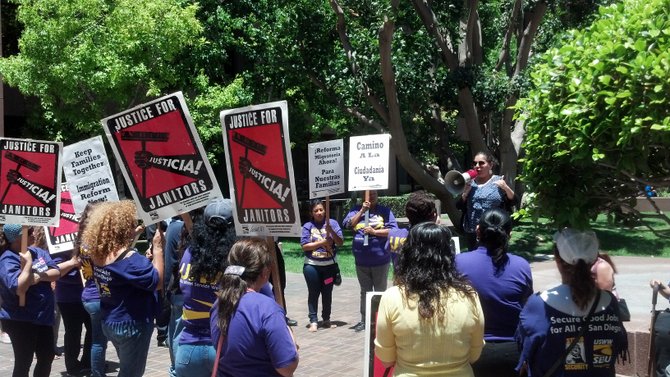 Genoveva Aguilar addresses service industry workers at a June 13 immigration rally