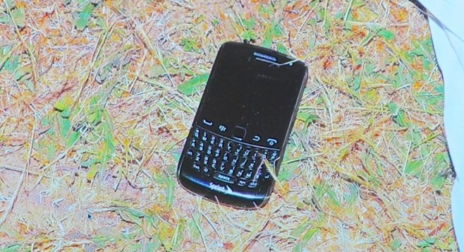 Investigators say they found a blackberry phone next to Upton's body, but no gun. Evidence photo