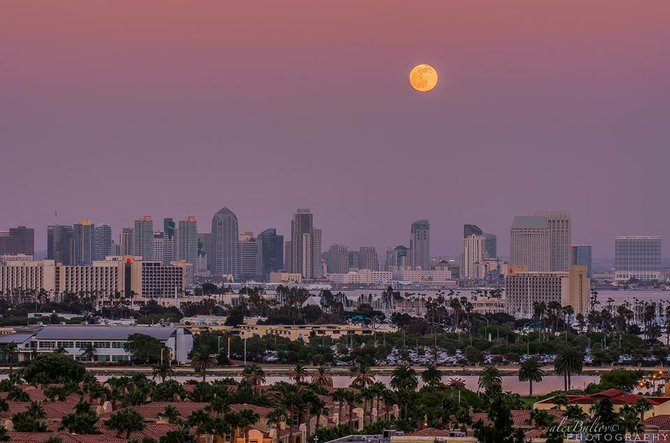 Full "Honey Moon" rising over the city, Harbor Island, and Liberty Station during a pink sunset. By Alex Baltov Photography.