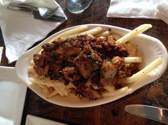 Poutine at Sessions Public: Shredded Pork, duck fat fries, brown gravy, aged white cheddar