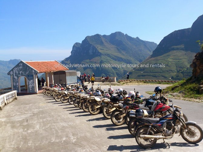 Ha Giang moutains on a sunny day with a large group of bikers. http://www.hiddenvietnam.com