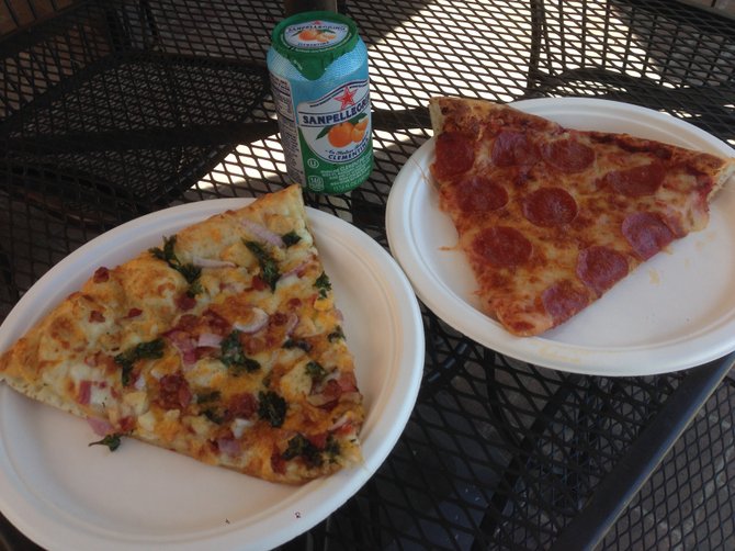 Couple of slices and a clementine soda. Alexander's Pizza.