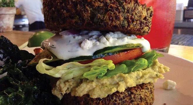 Inside Out Quinoa Burger, with hummus, tzatziki, tomato, cucumber, red onion, avocado, and feta