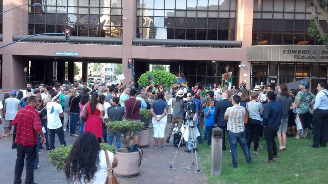 Crowd gathers at Downtown protest vigil in support of undocumented immigrant children