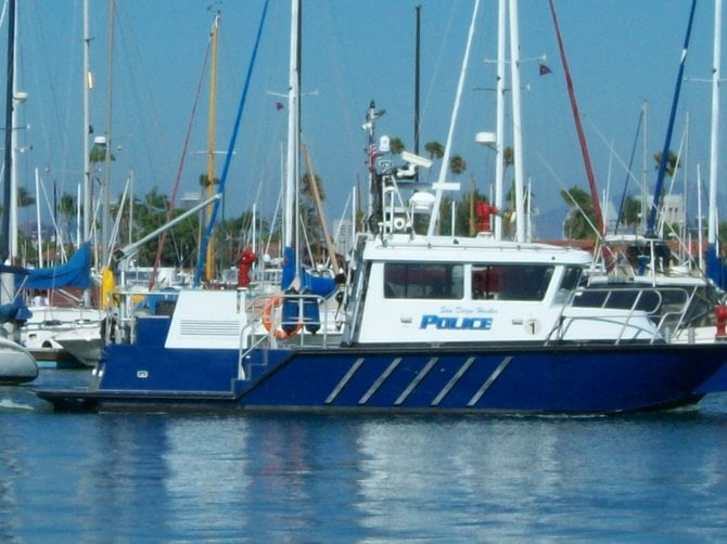 Harbor Police sail away from yacht club after another successful bust.