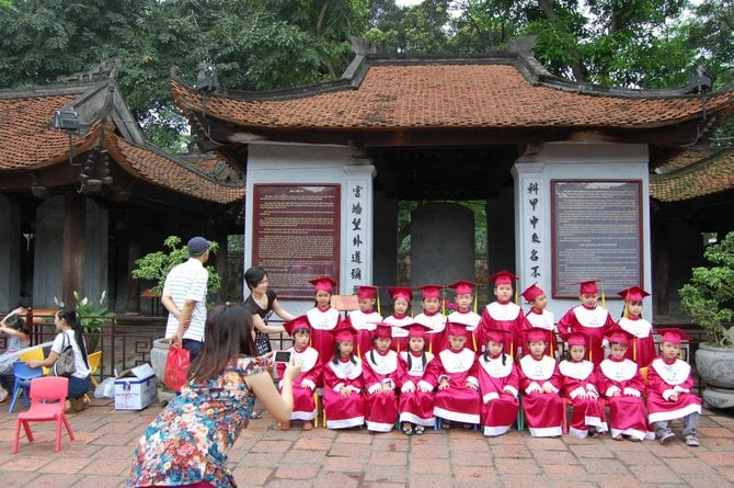 Young graduates at Hanoi's historic Imperial academy.