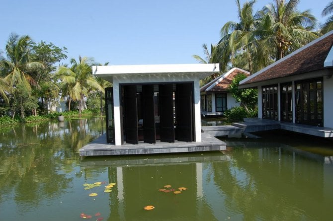 Massages are applied in bungalows upon the deluxe Nam Hai resort's spa lake.