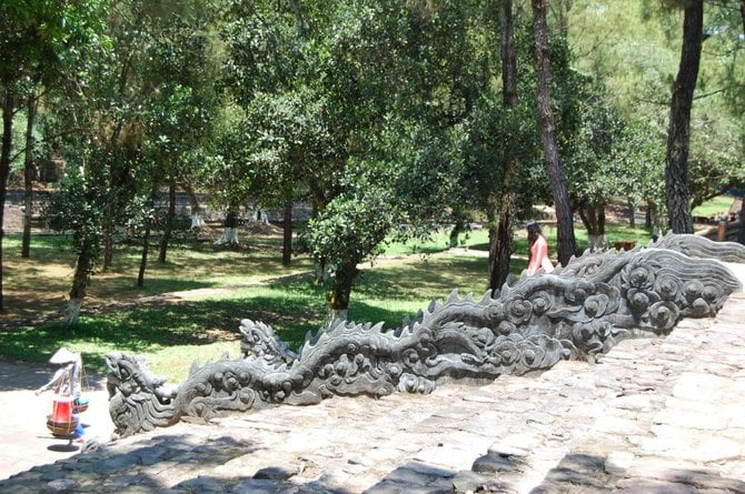 Vietnamese women descend a dragon staircase at Tu Duc Tomb, near Huế. 