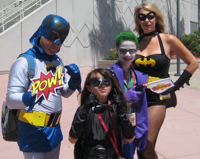 Batman, Hit-Girl, Joker and costumed woman with Batman logo