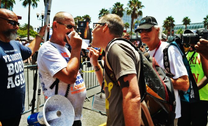 Born-again Christians square off with passersby at Comic Con, in the Gaslamp.