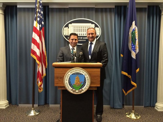 Pierre Sleiman, Jr.,and Pierre Sleiman, Sr., at the White House podium