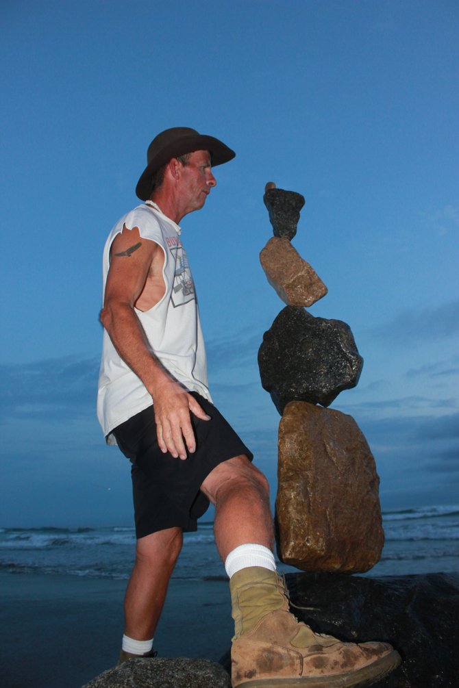 I would like to introduce to you to Mike, the gentleman who balances rocks with the utmost care on top of one another.  Mike finds the inner balance of each rock and creates these amazing statues anywhere and anytime.  My husband and I met Mike at the Oceanside Pier last month and he was happy to pose for me.  In this photo he had just placed the top rock and I happened to snap this photo within seconds of it.  Amazing huh?  
"it's a Vilma!"