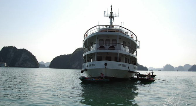 Our vessel, the Emeraude, surrounded by sampans at Halong Bay.
