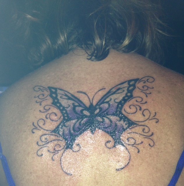 My tattoo is in honor of my mom. She passed away in May 2006 from Ovarian Cancer. We had a bench dedicated in her name where she had chemo. On that day a white butterfly landed on the bench and I knew she was with us. From then I knew I wanted a butterfly, it just took awhile to find the perfect one and a good tattoo artist. I just got my tattoo a couple weeks ago in Vegas by JayO. I love it. I think its beautiful and it means so much to me.
Thank you,
Valerie 
