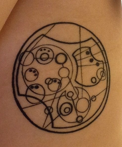 This is a tattoo I designed and drew out myself. There is a fan-made Doctor Who language (called Gallifreyan) created by Loren Sherman, and I used it to translate a quote/theme adapted from Paper Towns, a book by John Green (of YouTube's VlogBrothers and author of The Fault In Our Stars). It says “Imagine others complexly." These two "fandoms" were a huge part of my growth over the past few years as I finally began to figure out how to love what I love and appreciate myself and others for our complexities. I would not be the person I am today without the communities created . My tattoo is a reminder that my perspective is not the only perspective, and that people are far more than what you see on the surface. 

I am 23 and I live in Clairemont, I am a full-time student teacher and in the process of getting my Masters in Education at USD. I got this tattoo at Studio Tattoo in Henderson, Nevada.