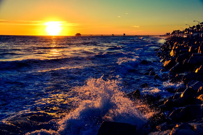 A captivating shot in Oceanside of the sun glistening on the surface of the ocean as it sets and says goodnight until morning comes.  
~Kate Murphy