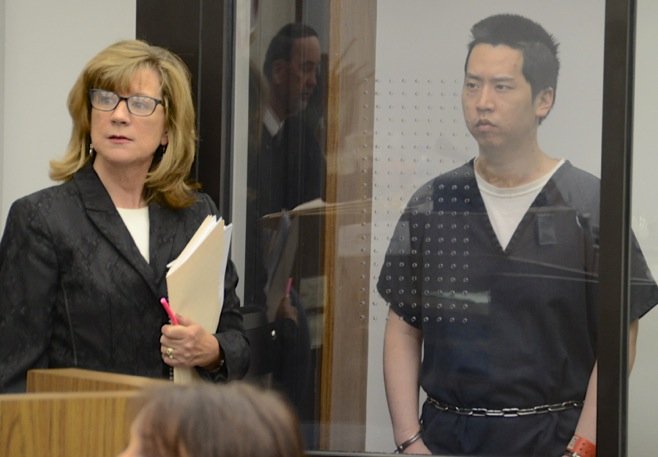 Attorney Kathleen Cannon w defendant Chang. Photo by Weatherston
